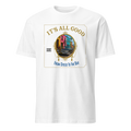 A white short-sleeve crewneck t-shirt featuring a large graphic print on the front. The graphic displays a colorful illustration of a vintage car in front of pastel-colored buildings, framed by gold text reading 'IT'S ALL GOOD' at the top and 'FROM DIEGO TO THE BAY' at the bottom.
